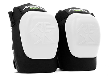 A pair of REKD Energy Patrol Ramp Knee Skate Protection Pads - White, showcasing the "REKD" logo on the front. These pads feature a robust white shell with black padding designed to absorb impact energy, providing optimal knee protection for extreme sports or physical activities.