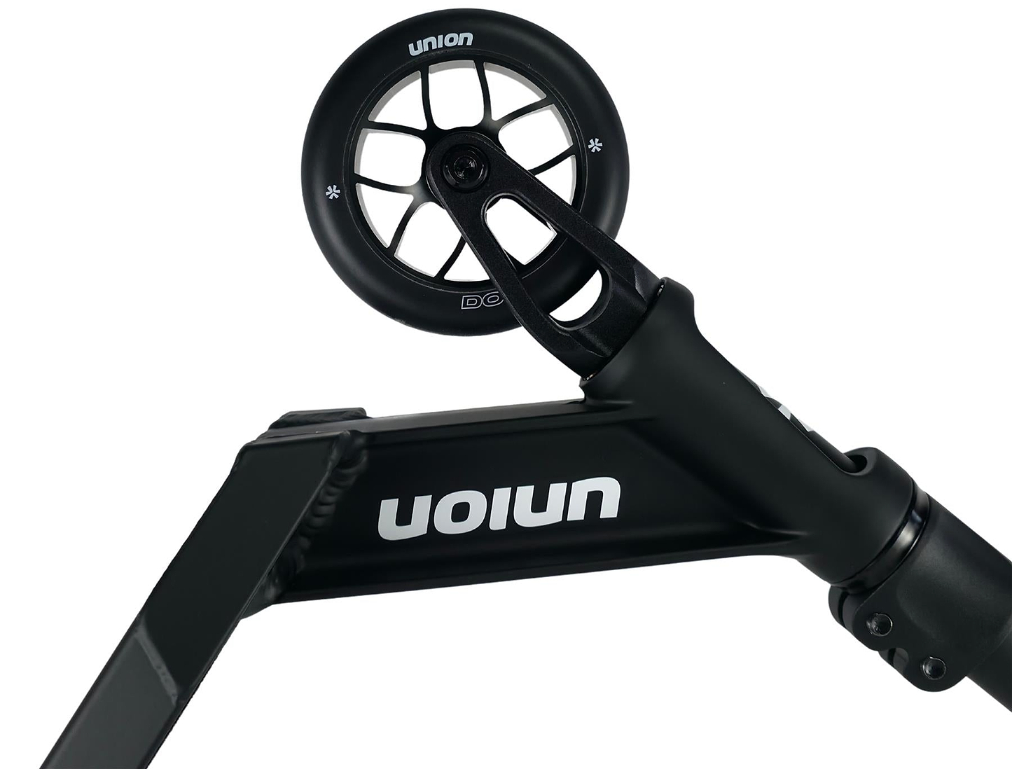 Close-up of the Union Dot Complete Stunt Scooter - Black, showing the front wheel and deck with the "Union" brand name printed in white, upside down on the side.