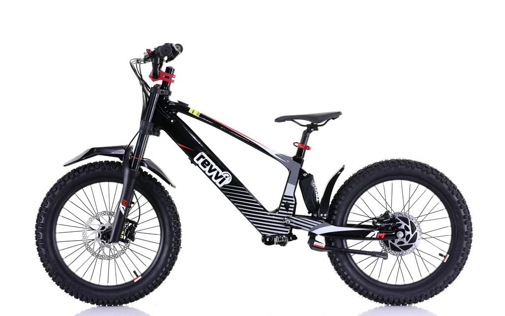The Revvi 20" Kids Electric Balance Bike in black boasts off-road rubber air-filled tires, disc brakes, and a unique striped frame with front and rear suspension. The brand name "Revvi" is prominently displayed on the frame.