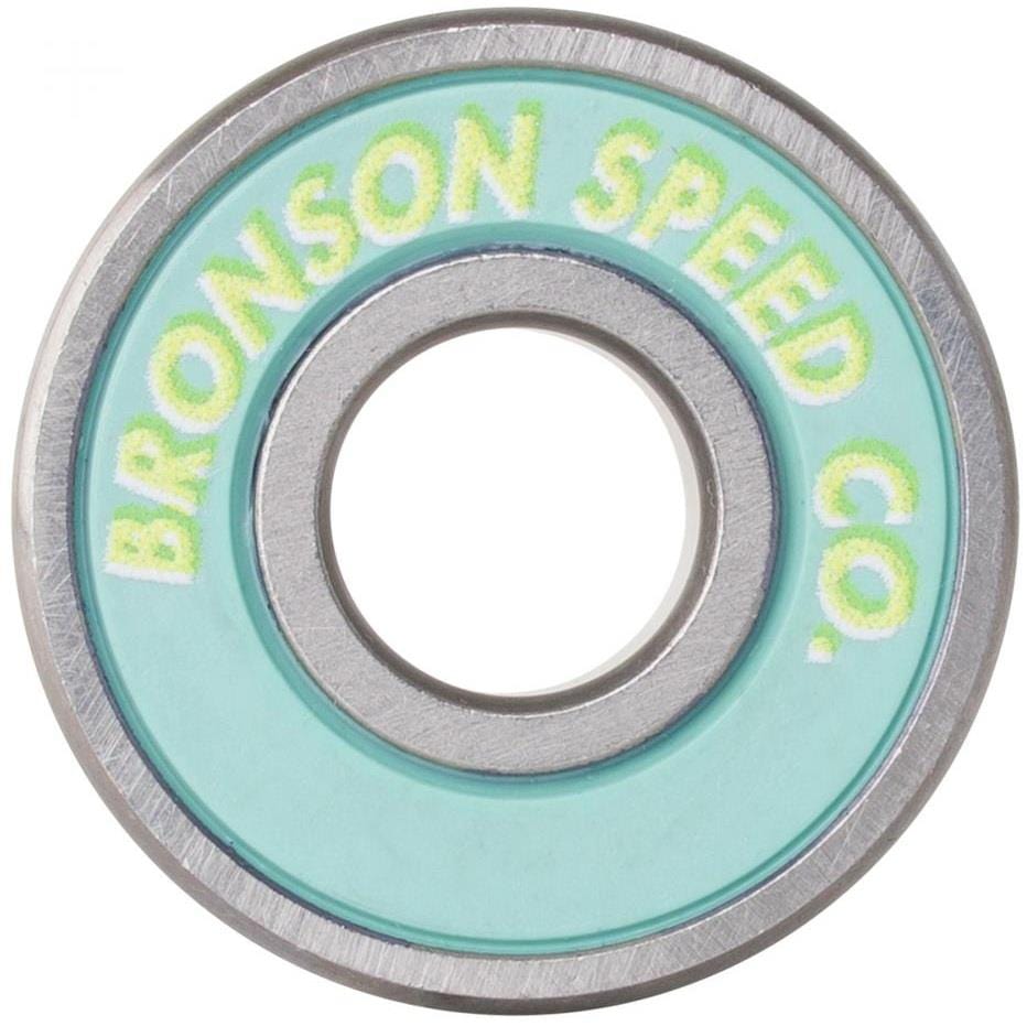 Close-up of Bronson Speed Co.'s Samarria Brevard Pro G3 Skateboard Bearing, showcasing a teal seal and yellow lettering on the silver inner ring.