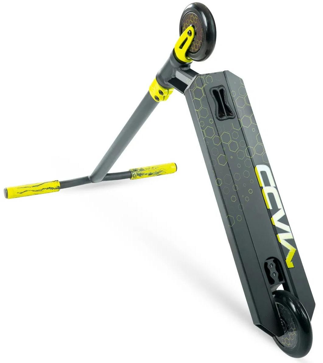 The Madd Gear Viral Rave Complete Stunt Scooter - Neon features a black and yellow design with neon accents, honeycomb-patterned deck branded "CCMV," yellow grips, and Madd Gear-inspired rims. Ideal for kids who love stunts.