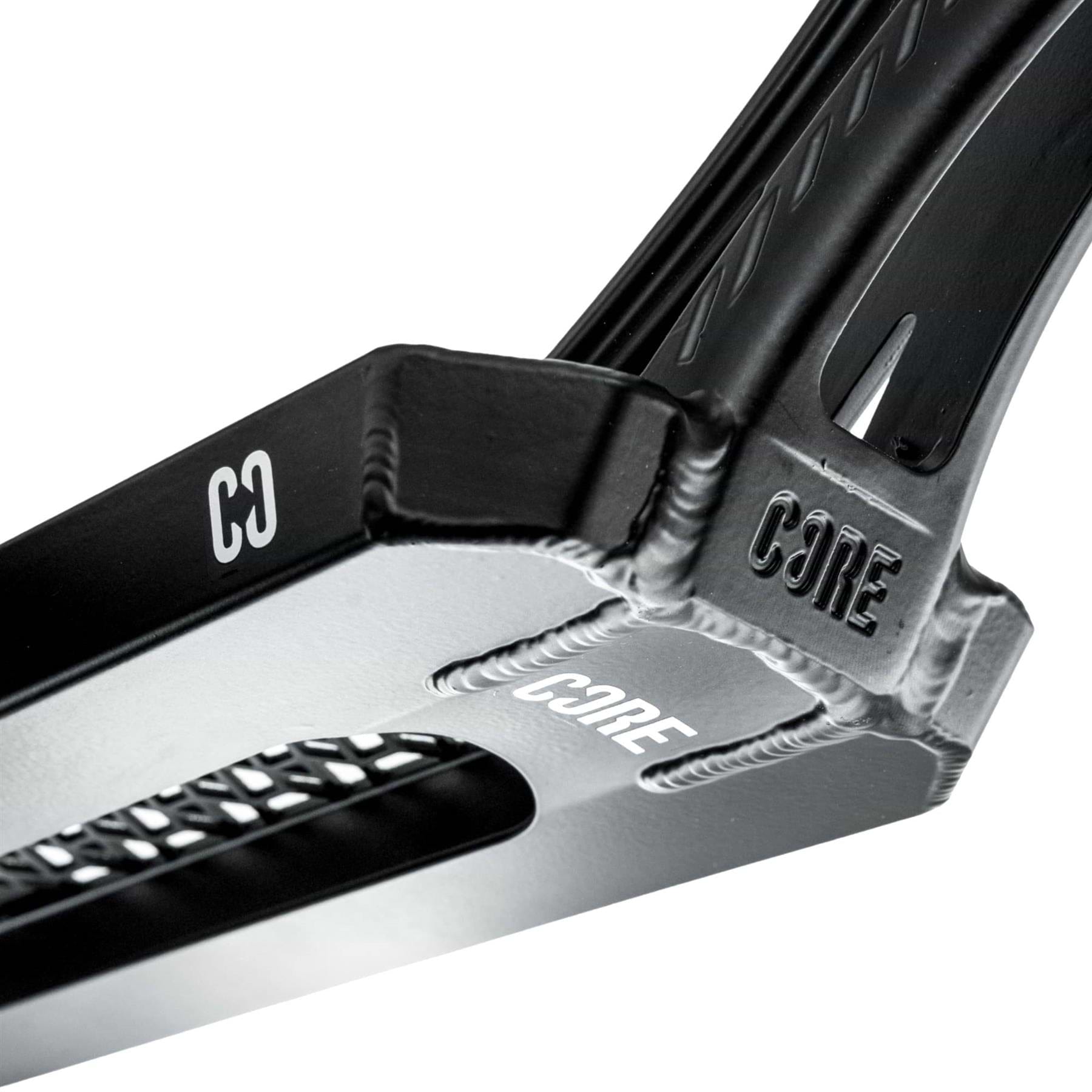 Close-up of the CORE SL3 Forged Black Stunt Scooter Deck (5.25" x 19.3"/20.5") by CORE, featuring engraved and printed branding, textured details, and a rectangular cutout—ideal for park scooter setups.