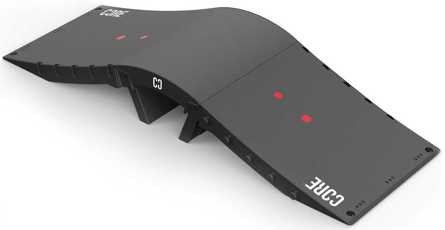 The CORE Mini Wave Bridge Connector is a black modular ramp with a wavy surface, two red circular markers, and “CORE” in white on both ends—ideal for any skate setup and compatible with ramp connectors for customization.