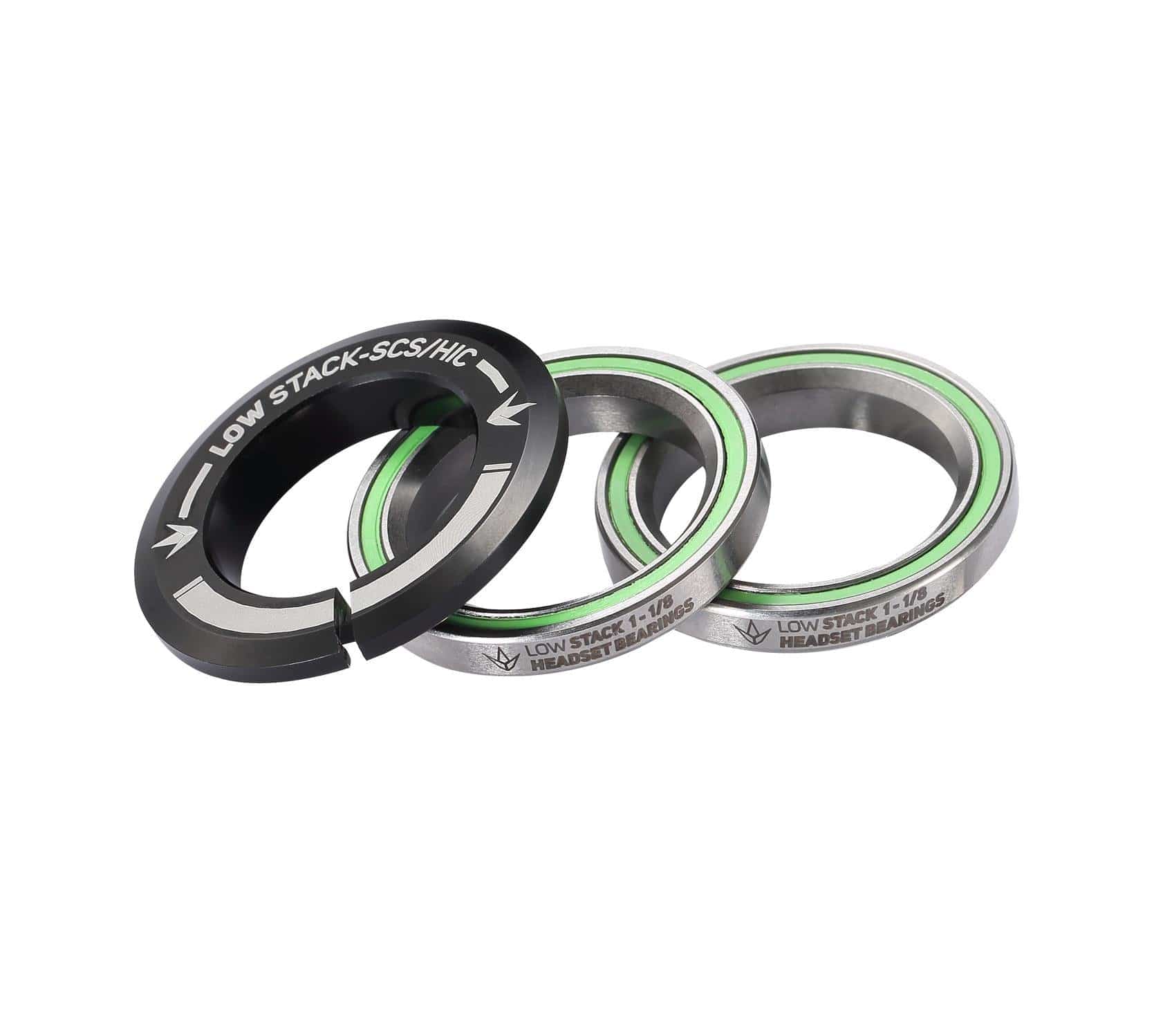 Three Blunt Envy Low Stack SCS Integrated Stunt Scooter Headset bearings with green seals are displayed on a white background. The black bearing cover features the text "LOW STACK-SCS/HIC," emphasizing their compatibility with the SCS compression system.
