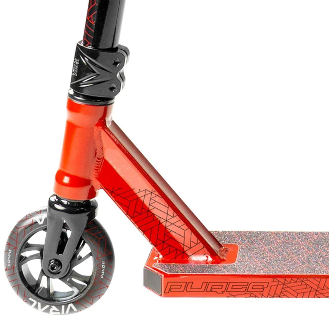 Close-up of the Madd Gear (MGP) Viral Purge Complete Stunt Scooter - Cherry, highlighting the front wheel, fork, deck, and handlebars with bold geometric patterns—ready for action at any skatepark.