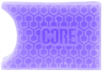 A rectangular blackcurrant purple grip with a honeycomb pattern and "CORE" embossed in the center, inspired by CORE Epic Skate Wax – Blackcurrant Purple, featuring a curved notch on the top left for skate wax fans.