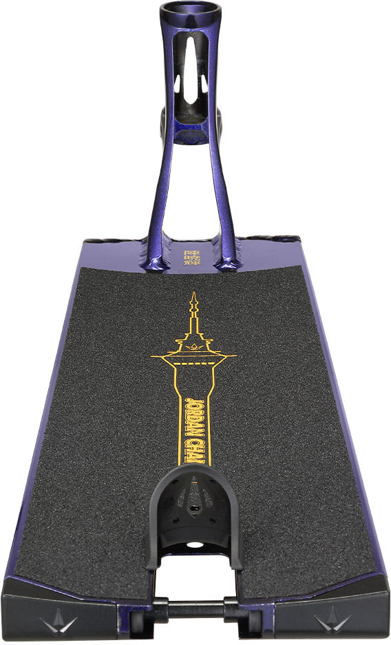 A close-up of the Blunt Envy AOS V6 Jordan Chan Signature Stunt Scooter Deck - 6.5″ x 22.5″, shown in purple with black grip tape featuring a yellow tower graphic, photographed from the rear.