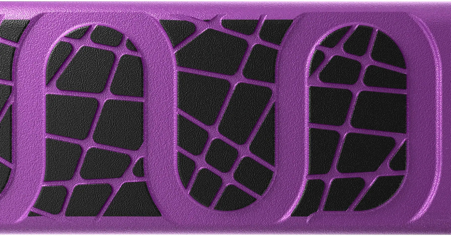 Close-up of the INDO Kickstart Voltage Complete Trampoline Stunt Scooter - Purple by INDO, showing a black surface with an abstract purple geometric pattern of web-like lines and oval shapes—echoing the dynamic style of this adjustable-handlebar stunt scooter.