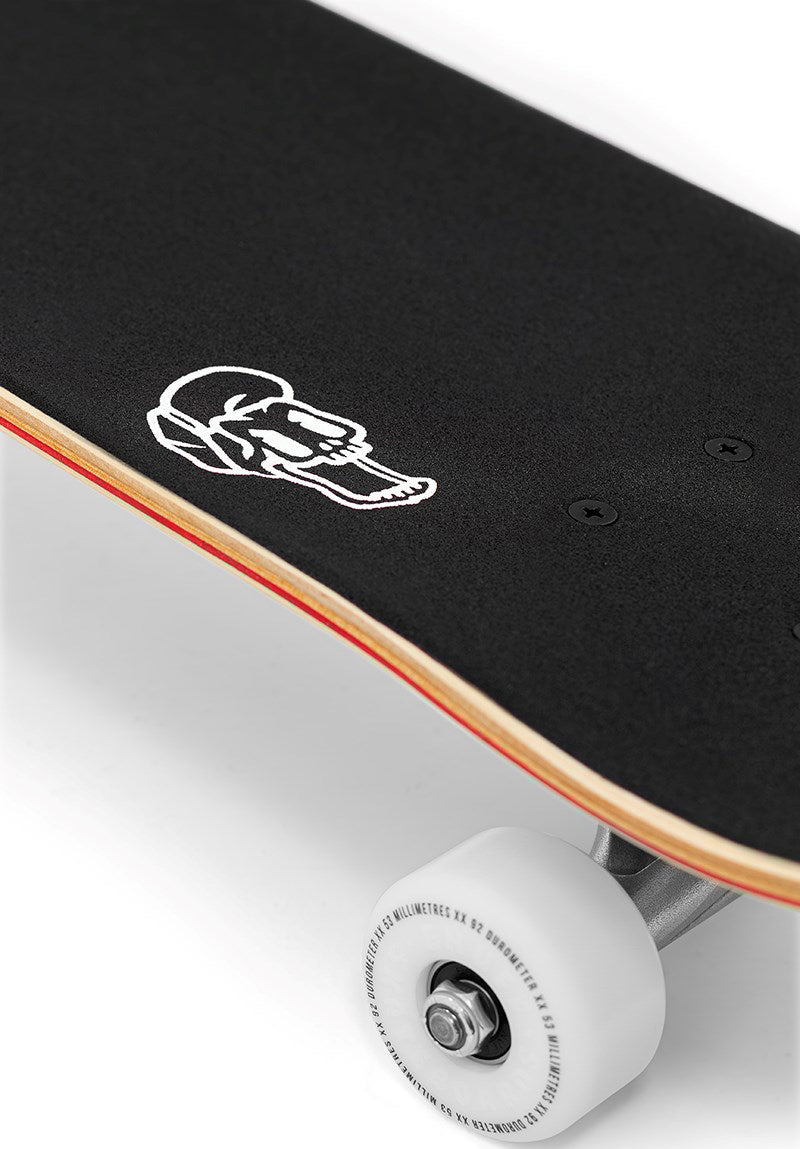 An Enuff Skully Blue Complete Skateboard - 7.75″ x 31.5″ with black grip tape featuring a white skull icon near the tail and one white wheel visible.