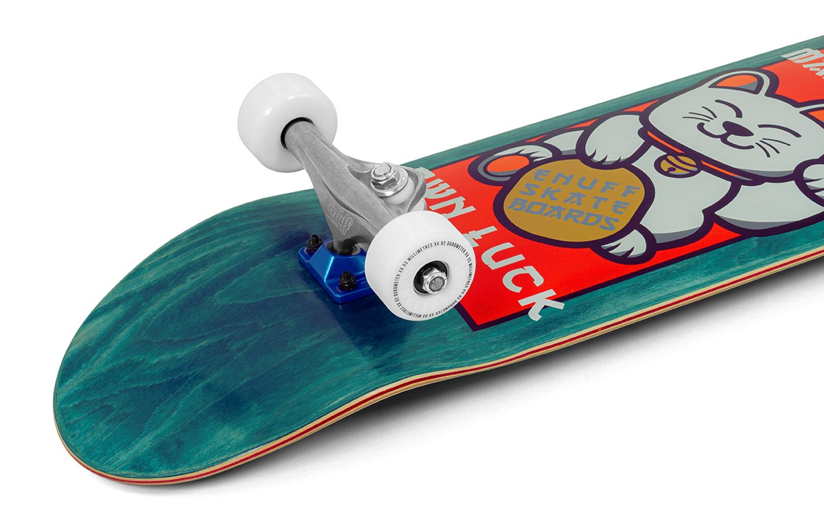 A close-up of the Enuff Lucky Cat Green Complete Skateboard - 8″ x 32″ by Enuff, showcasing a teal deck with a lucky cat holding a coin graphic. Equipped with white wheels and silver trucks, this beginner-friendly skateboard is ideal for both street and park skating.