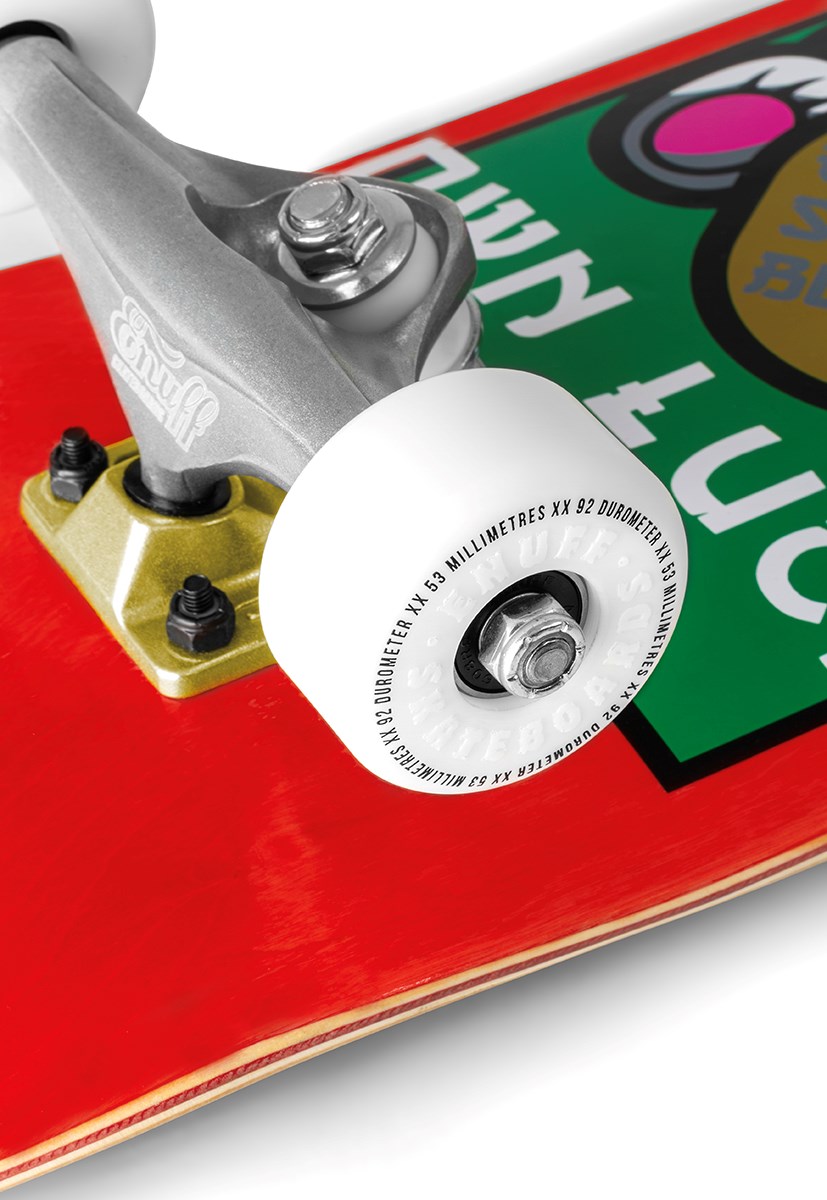 Close-up of the Enuff Lucky Cat Red Complete Skateboard (8.0" x 32") by Enuff, featuring a green and black graphic with white text, red deck, detailed hardware, and metal truck—ideal for beginner street and park skaters.
