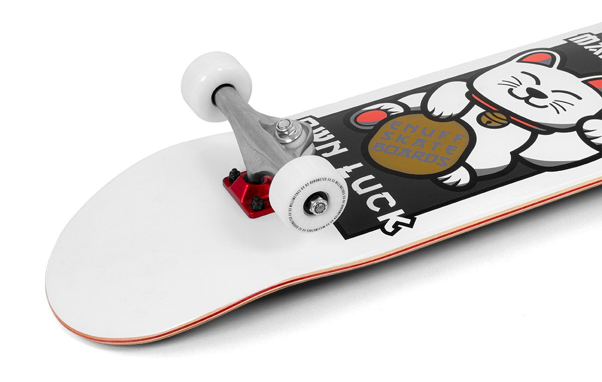 Close-up of the Enuff Lucky Cat White Complete Skateboard - 8″ x 32″ by Enuff, an ideal choice for beginners interested in street and park skating. This skateboard features a white deck adorned with a lucky cat graphic clutching a gold coin, complemented by white wheels and silver trucks. The phrases “ENUFF SKATE BOARDS” and “GOOD LUCK” are displayed on the deck.