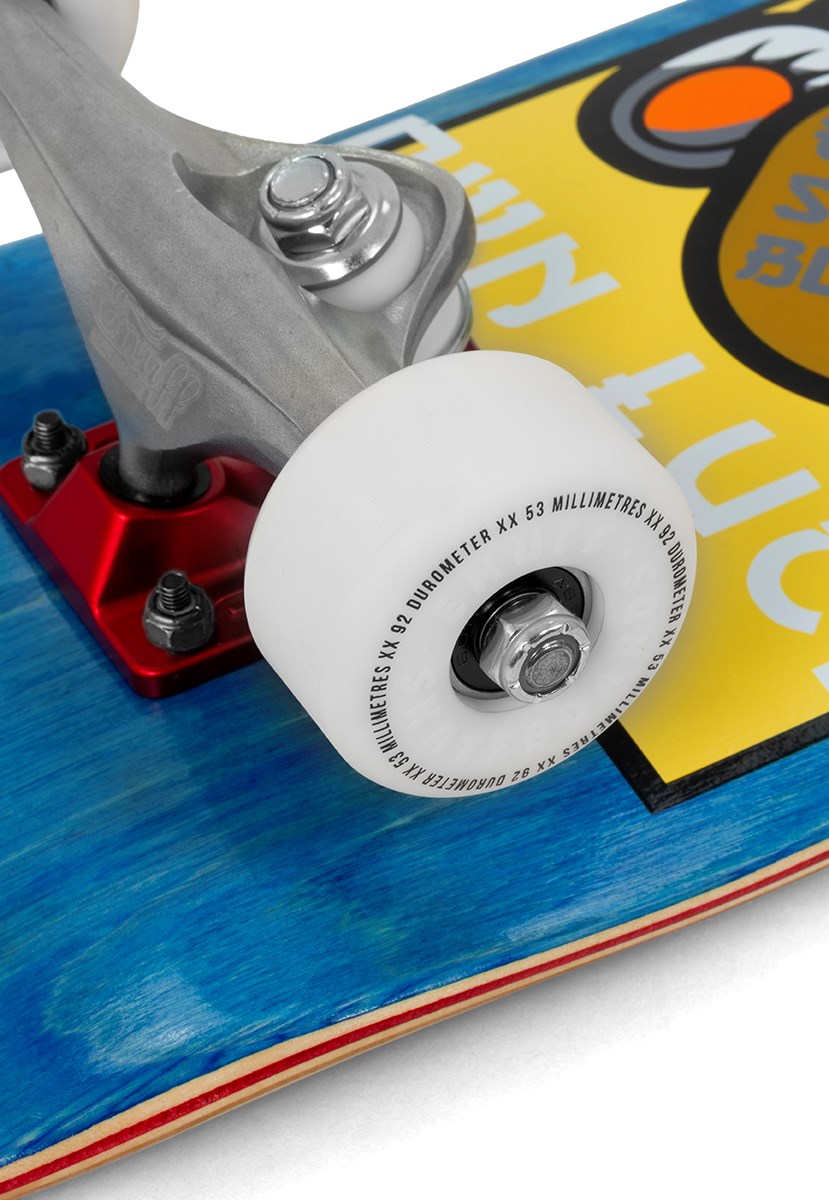 Close-up of an Enuff Lucky Cat Mini Blue Complete Skateboard’s white wheel and metal truck mounted on a blue wooden deck with a vibrant, partially visible graphic—perfect as a mini skateboard for kids or beginners. This 7.25″ x 29.5″ complete skateboard is by Enuff.