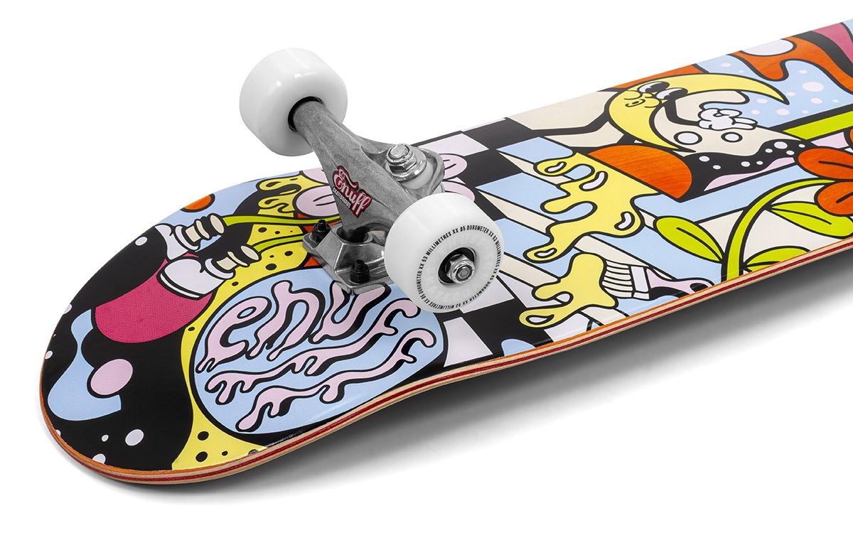 The Enuff Meltworld Mini Dazed Complete Skateboard (7.25" x 29.5") by Enuff features white wheels and trucks, plus a vibrant abstract deck graphic with cartoon designs in yellow, purple, blue, red, and black.