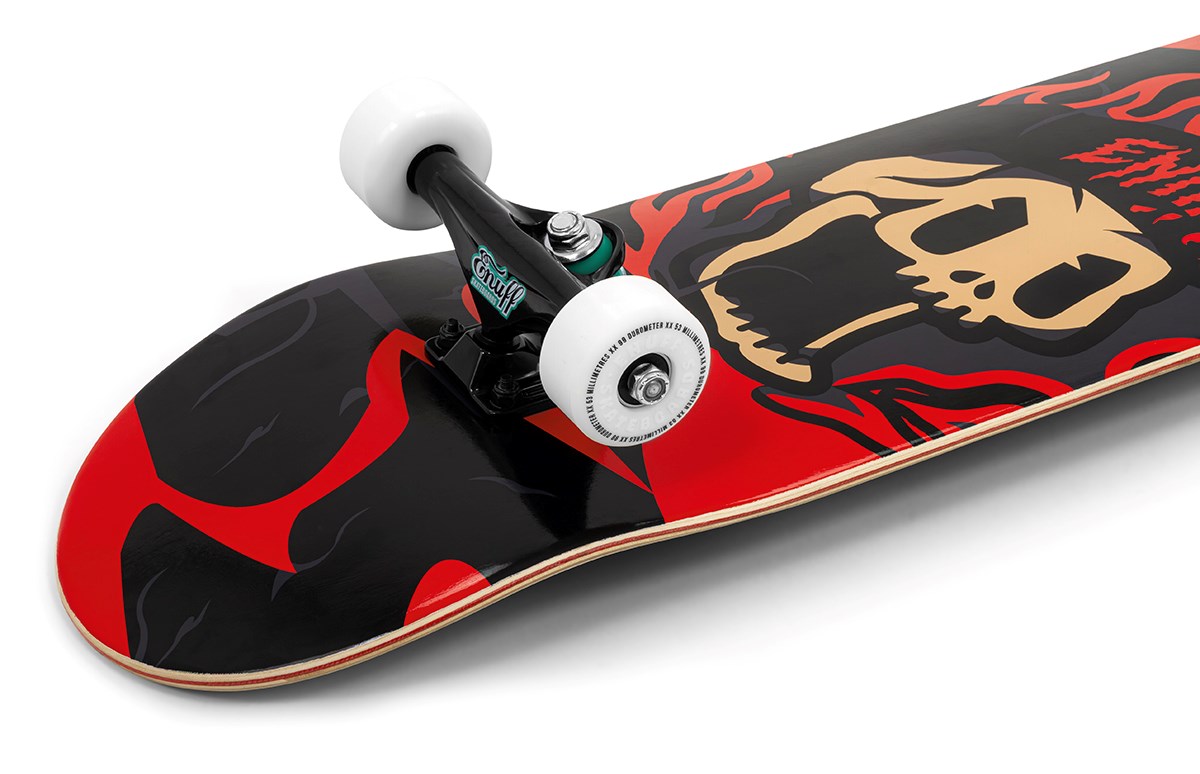 A close-up of the Enuff Pyro III Red Complete Skateboard (7.75" x 31.5") by Enuff, featuring a bold screaming skull graphic with red and black flames, white wheels, black trucks, and a durable 7-ply maple deck.