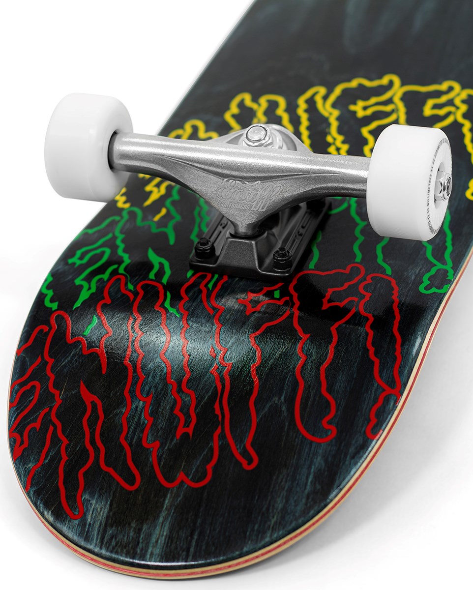 Close-up of the Enuff Three Tier Reloaded Black Complete Skateboard (8.0" x 32.0") tail, showing white wheels, silver trucks, and a dark 7-ply maple deck with red, yellow, and green wavy graphic text.