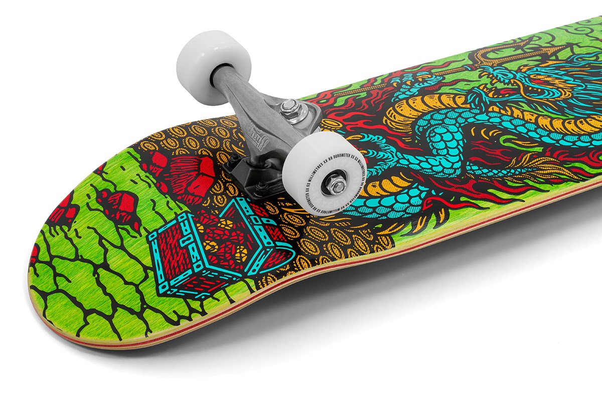 A close-up of the Enuff Yokai Dragon Complete Skateboard - 8.25" x 32.1" shows vibrant blue and yellow Japanese dragon art, red roses, a treasure chest, white wheels, and silver trucks. Brand: Enuff.
