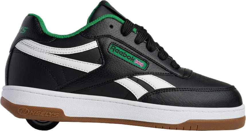 The Heelys x Reebok Classic Boys Shoes - Black / White / Gum feature black uppers, white details, green trim, and a hidden heel wheel—retro style from Heelys, displayed on a white background.