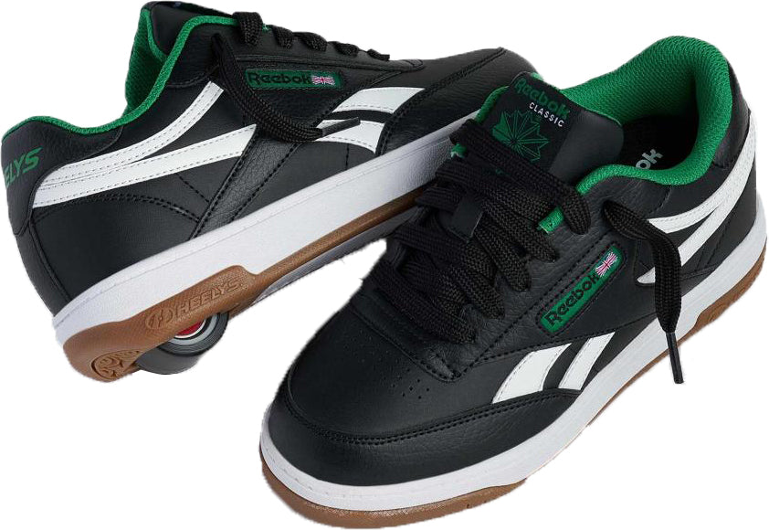 The Heelys x Reebok Classic Boys Shoes - Black / White / Gum feature black uppers, white accents, green lining, gum soles, and Reebok logo details—stylish everyday shoes for boys.