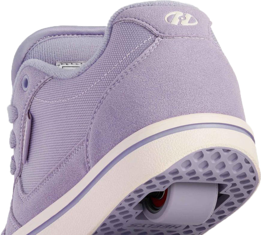 A close-up of the Heelys Pro 25 Girls Shoes - Purple / Cream by Heelys, showing a single wheel in the heel—fun wheeled sneakers perfect for active kids.
