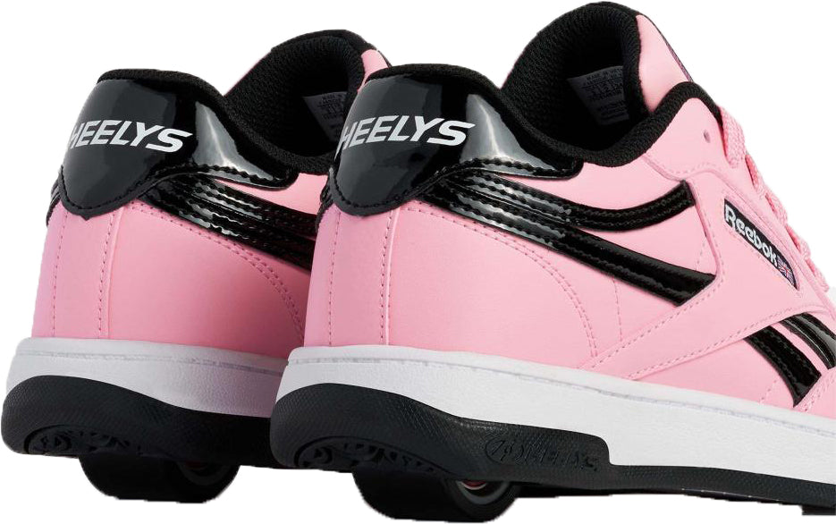 Heelys x Reebok Club C Girls Shoes - Candy Pink / Black / White by Heelys, shown from the back and side with wheels in the heels—fun rolling shoes perfect for girls.