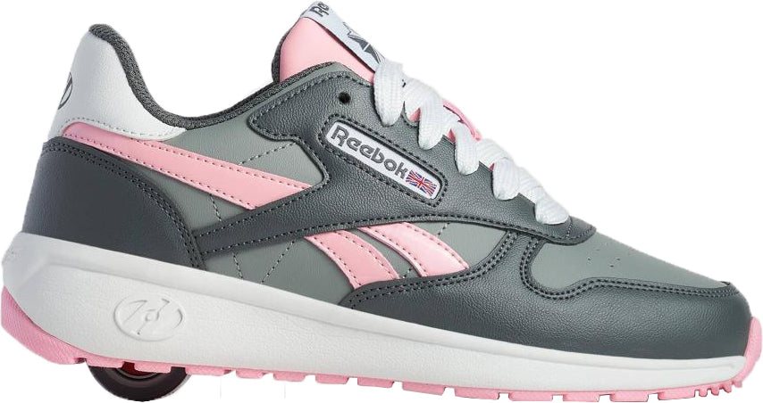 The Heelys x Reebok Classic Girls Shoes - Grey / Pink / White feature white laces and a hidden heel wheel—ideal for casual wear or skating, perfect as Heelys girls shoes.