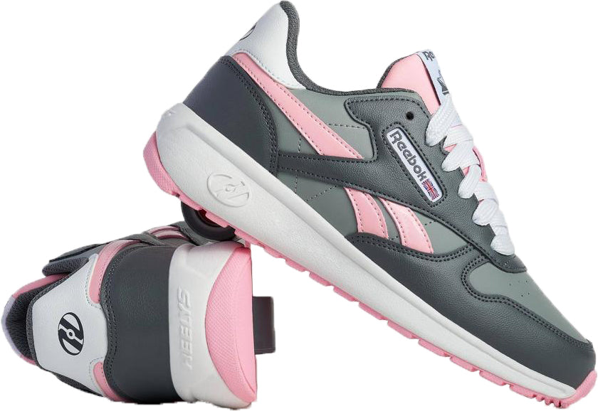 The Heelys x Reebok Classic Girls Shoes - Grey / Pink / White feature iconic side logos and pink soles—stylish and perfect for the skate park or everyday wear.