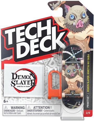 The Tech Deck 96mm M04 Primitive x Demon Slayer Fingerboard—Inosuke Hashibira edition—comes in packaging featuring the “Demon Slayer” theme and showcases the character Inosuke Hashibira. This collectible set from Tech Deck includes a 96mm fingerboard, a tool, and a logo sticker, making it ideal for skateboard collectibles enthusiasts. Warning labels are displayed prominently on the front of the packaging.