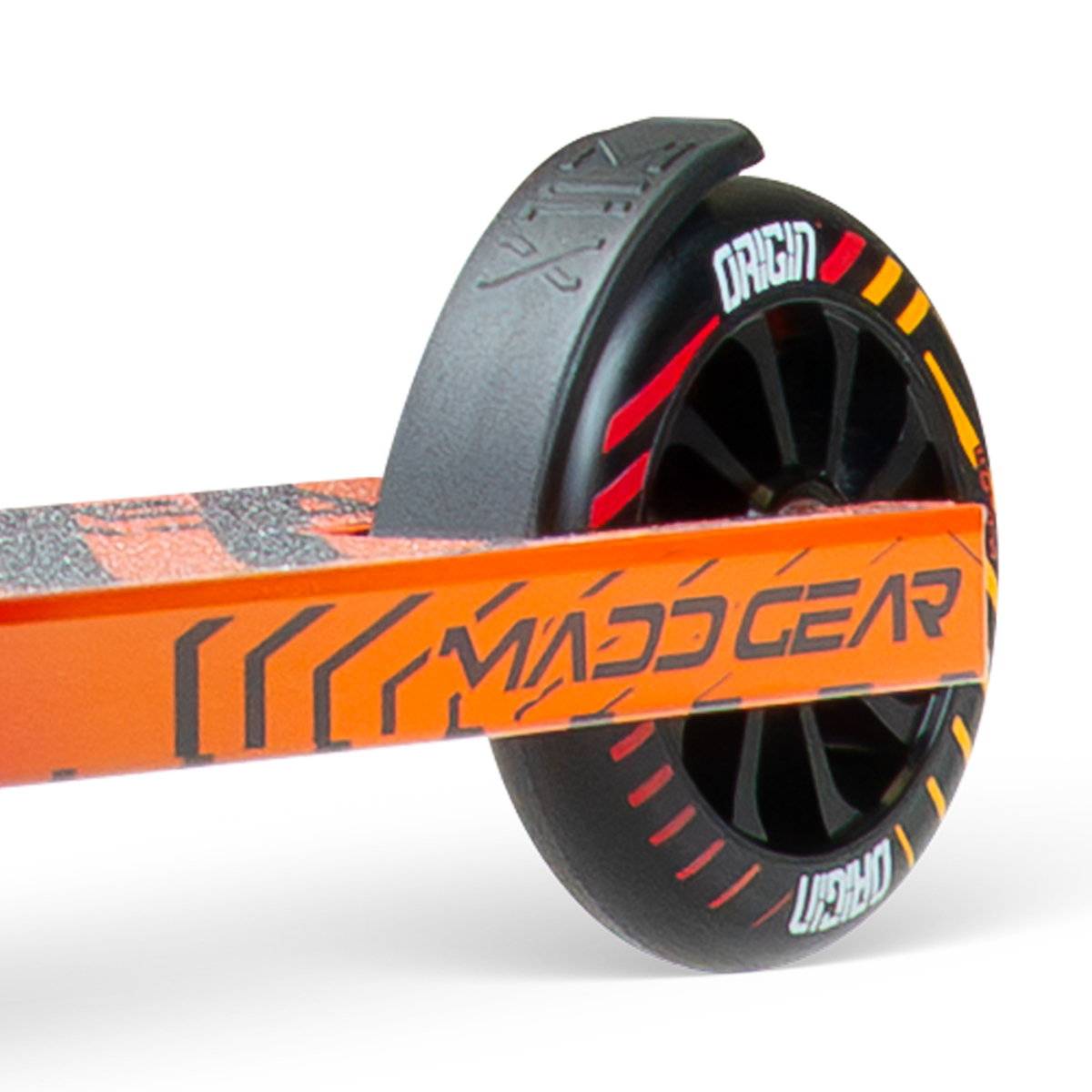 Close-up of the rear wheel and deck on the Madd Gear (MGP) VX Origin IV 450 Complete Stunt Scooter - Phonon, featuring black and red wheels with "Origin" and "URHD" text, plus bold branding—ideal for park riders who want both style and performance.