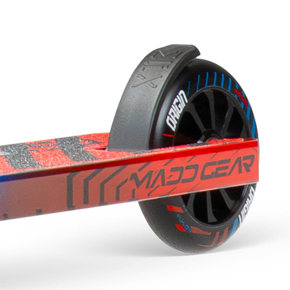 Close-up of the rear wheel and deck on the Madd Gear (MGP) VX Origin IV 450 Complete Stunt Scooter - Tensor, featuring a black wheel with blue/red details and branded deck—ideal for park riders.