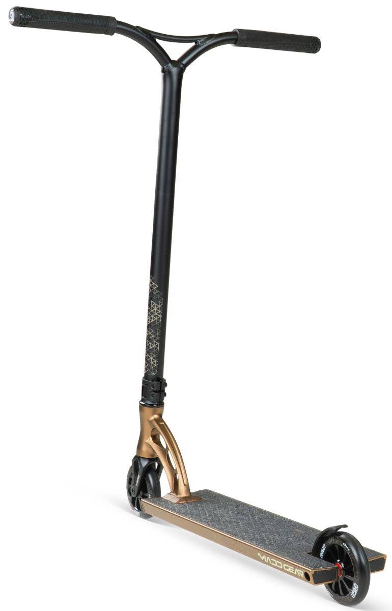 The Madd Gear (MGP) VX Origin IV 550 Complete Stunt Scooter in Antique Brass features a T-bar handle, black grips, textured foot deck, and small black wheels—ideal for park riders—shown on a white background.