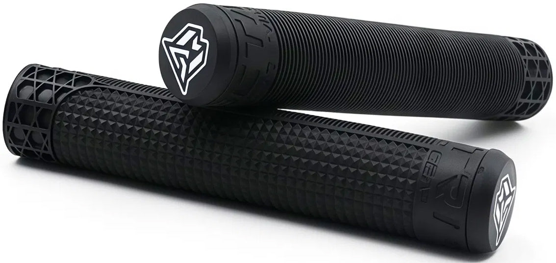 A pair of Madd Gear MGP Trifecta Black Stunt Scooter Grips, each 150mm long, featuring textured black surfaces with white logos on the ends—these grips from Madd Gear offer comfort and durability for your ride, shown here on a white background.