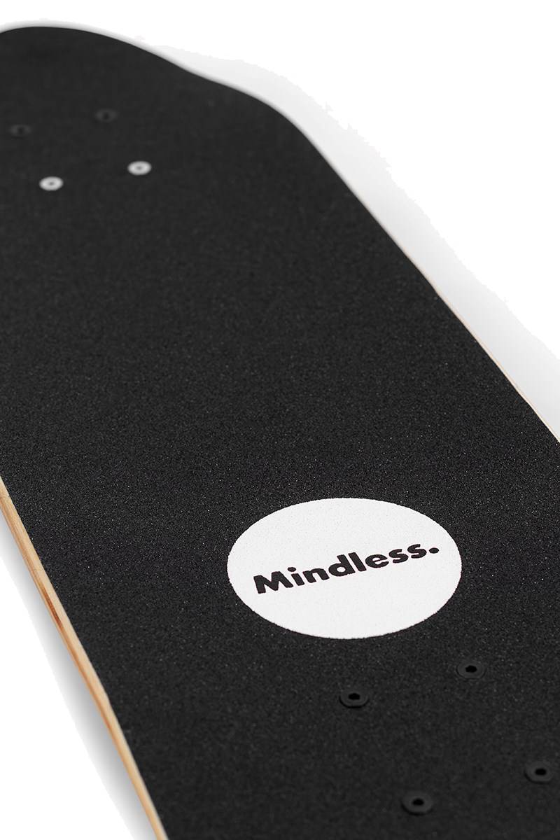 A close-up of the Mindless Drifter Cruiser Skateboard 28″ x 8″ - Orange, showing its deck with a white circle near the tail and “Mindless.” printed in the center.