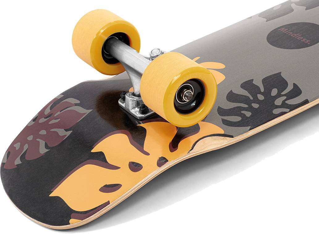 Close-up of a Mindless Oasis Cruiser Skateboard 32″ x 9″ - Black with yellow wheels and a yellow and brown tropical leaf pattern on a gray maple deck.