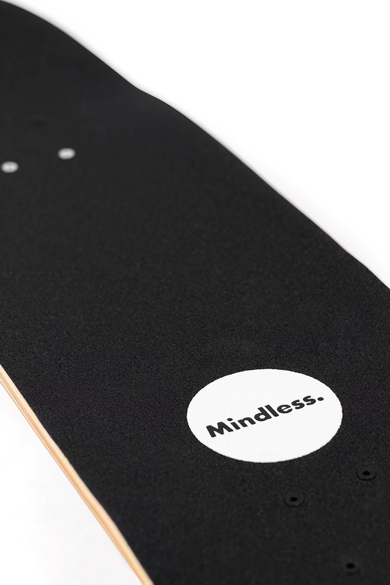 Close-up of the Mindless Oasis Cruiser Skateboard 32″ x 9″ - Natural shows its black maple deck, white circle near the tail with “Mindless.” print, grip tape detail, and Oasis Cruiser ABEC 9 Chrome bearings.