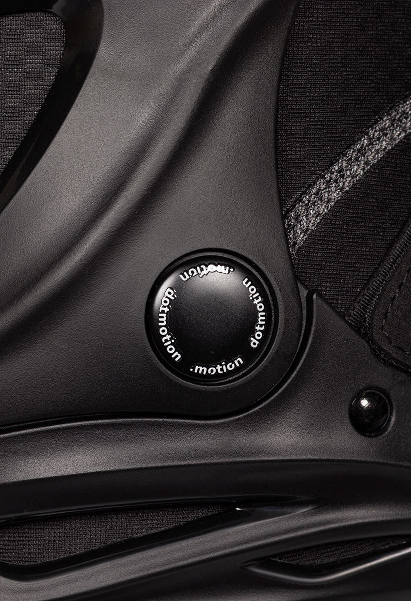 Close-up of a black .motion Dreamstate Inline Skate featuring a circular adjustment dial with the word “dotmotion” printed around its perimeter.