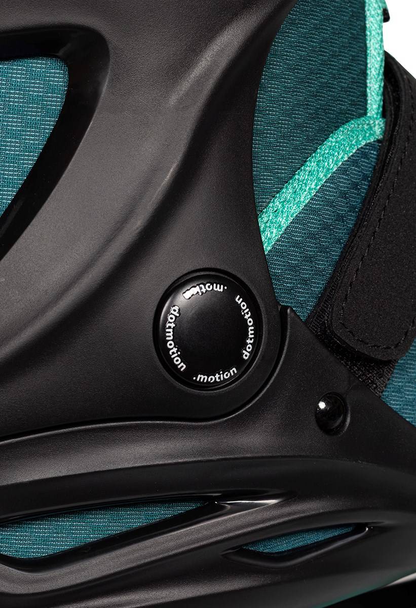 Close-up of a teal and black .motion Dreamstate Inline Skates, highlighting the circular adjustment dial on the side.