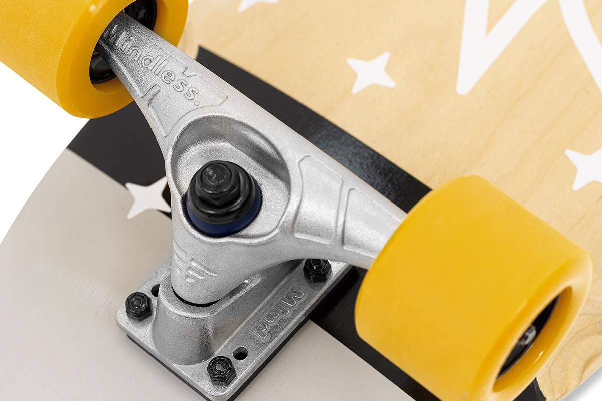 Close-up of a silver Mindless truck and yellow wheels on the Mindless Soul Surf Skate Cruiser Skateboard 29.5″ x 9.75″ - Brown, featuring white star graphics for smooth carving and stylish rides.