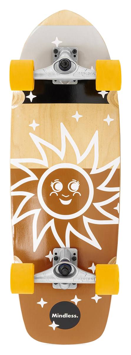 The Mindless Soul Surf Skate Cruiser Skateboard 29.5″ x 9.75″ - Brown features yellow wheels, a wooden deck, and a sun graphic with a smiling face and stars. “Mindless.” appears at the bottom.