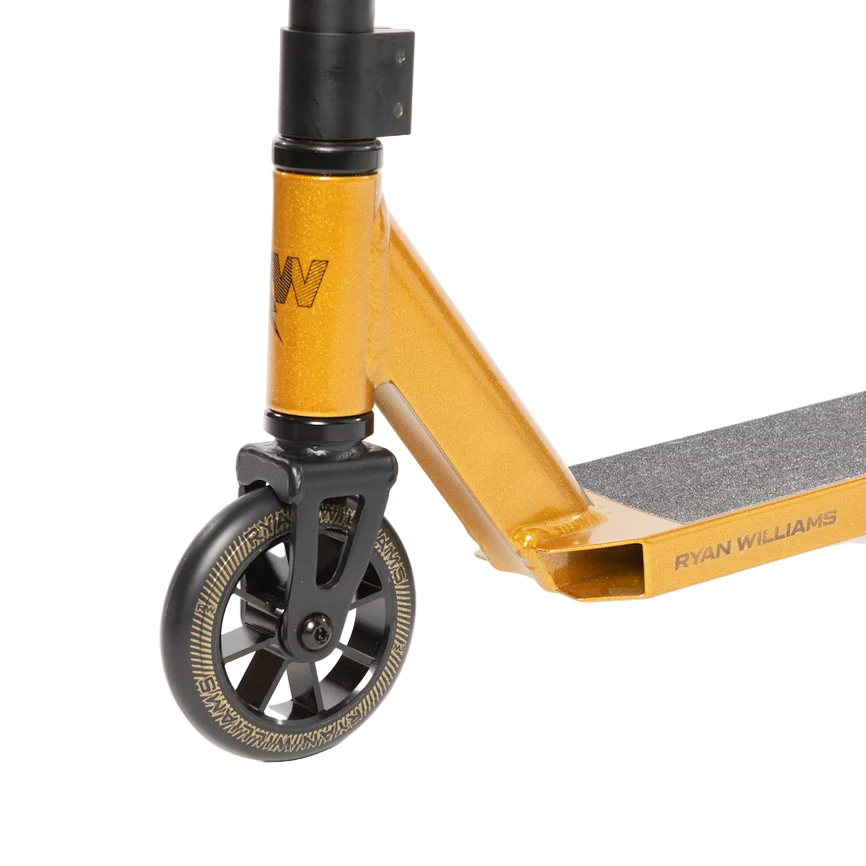 Close-up of the Nitro Circus Ryan Williams Signature Replica 2025 Complete Stunt Scooter in gold and black, showing the front section with black grip tape, a black and gold wheel, and "RYAN WILLIAMS" printed on the deck.