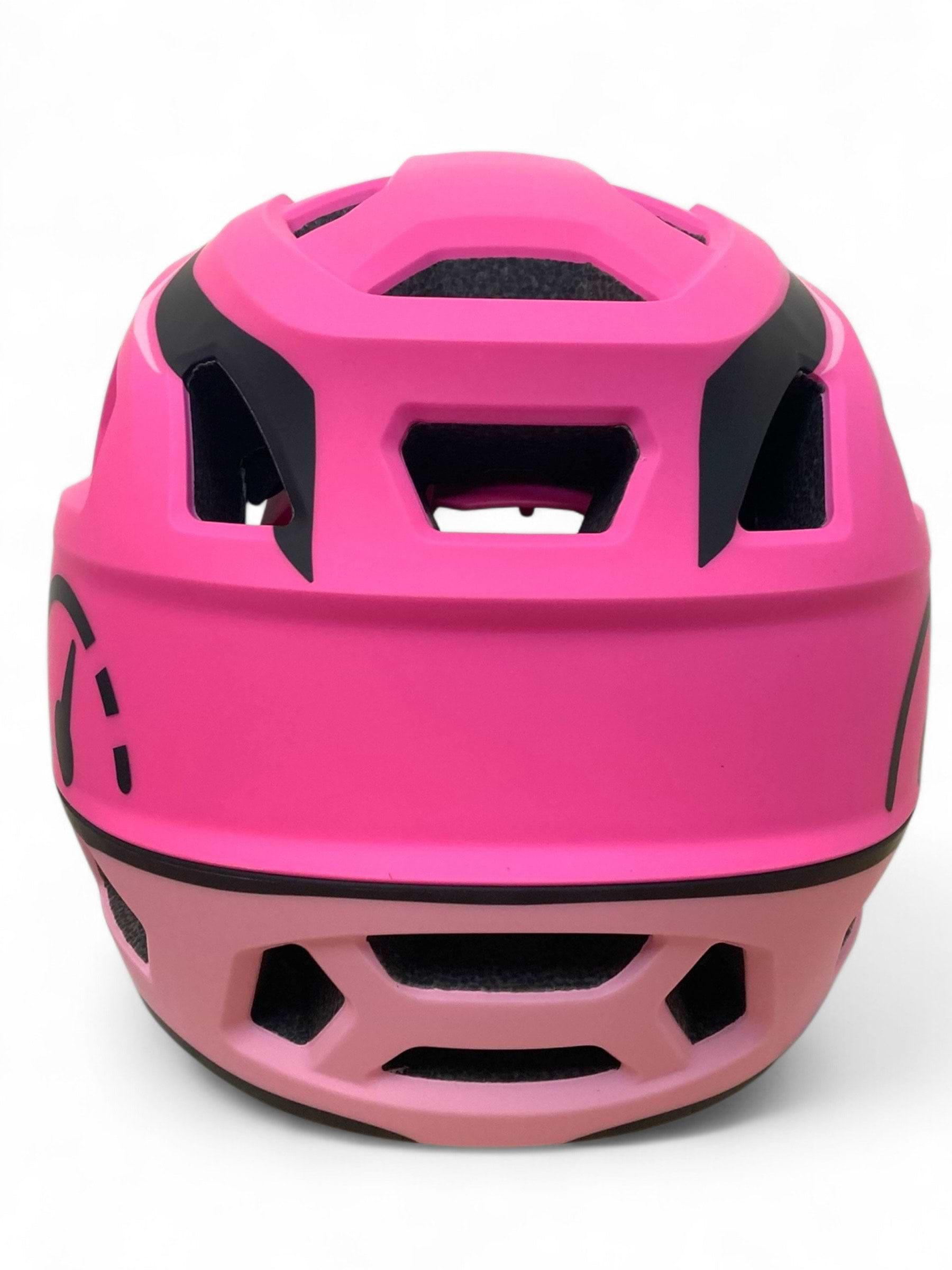 A close-up of the Revvi Kids Full Face MTB Helmet in pink by Revvi, featuring black accents, ventilation holes, and a smooth, contoured design against a white background.