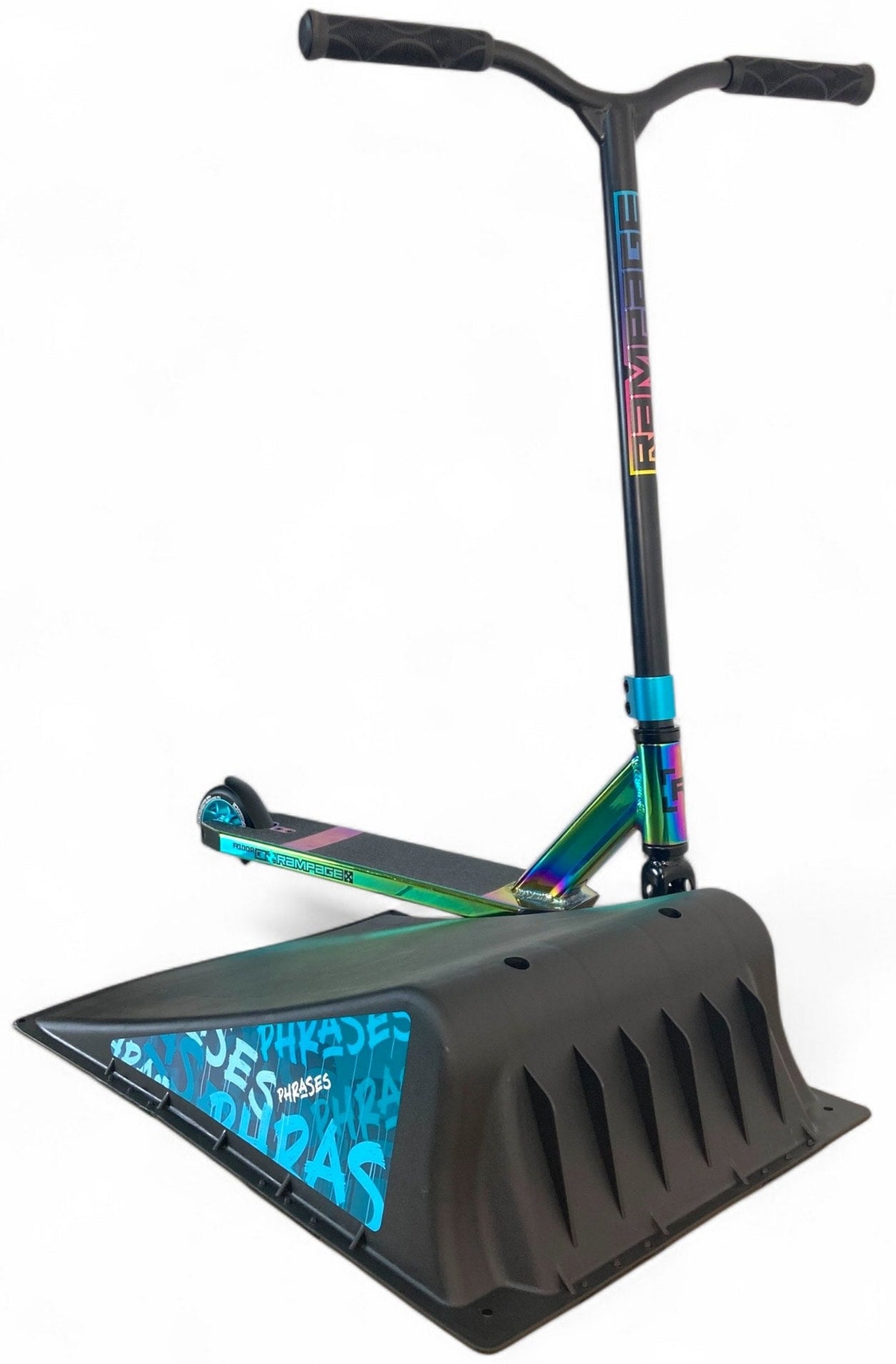 A colorful stunt scooter stands upright with its front wheel on the Phrases One Way Kicker Skate Ramp by Phrases, featuring blue graffiti-style text, all against a plain white background—ideal for beginner skateboarders and scooter fans.