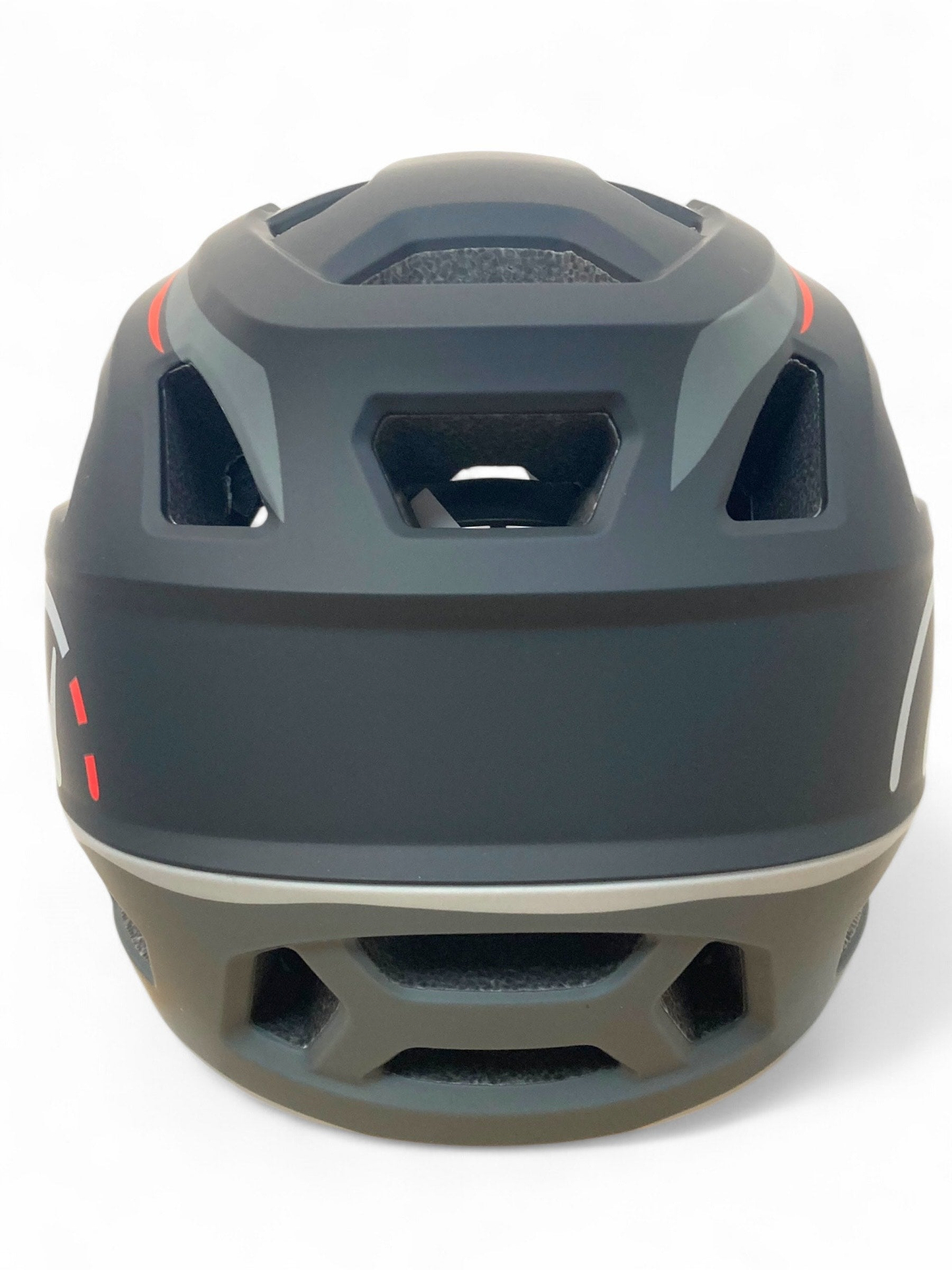 The Revvi Kids Full Face MTB Helmet by Revvi in matte black features geometric rear vents, red and gray accents, and a sleek, aerodynamic design.