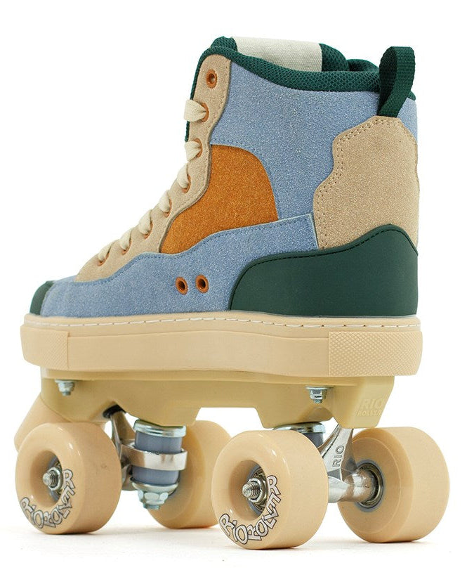 The Rio Roller Beats Quad Roller Skates by Rio Roller feature a retro high-top design with blue and tan panels, a beige sole, light tan wheels, and a silver frame—perfect for stylish and durable skating.