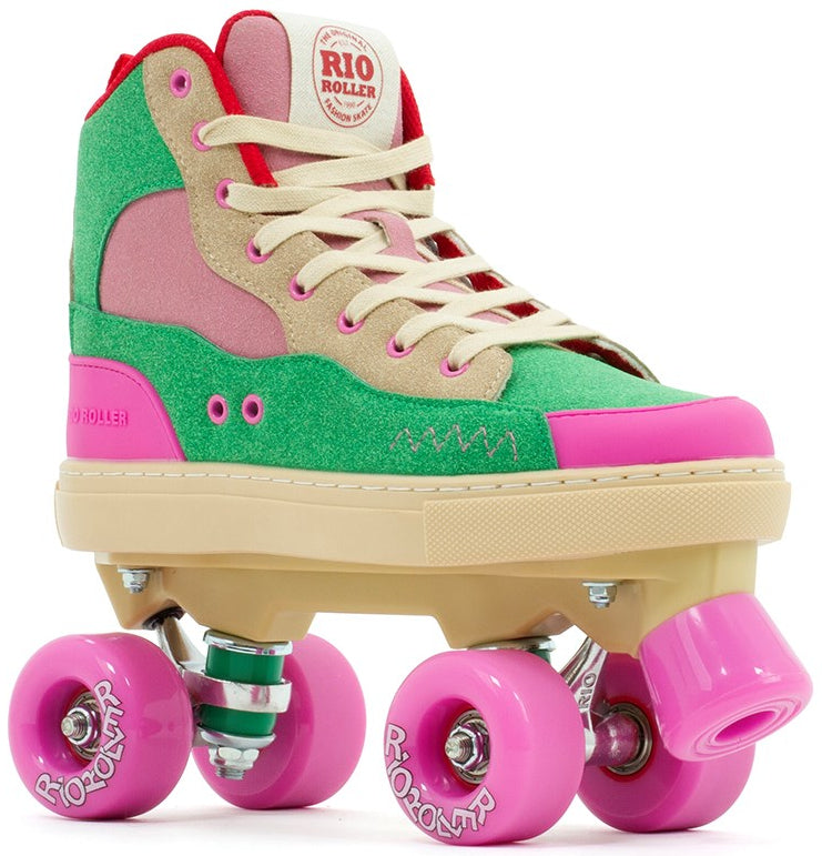The Rio Roller Beats Quad Roller Skates in Pink/Green feature a durable high-top boot with cream laces, a beige sole, and bright pink wheels, plus the "Rio Roller" logo on the tongue and wheels.