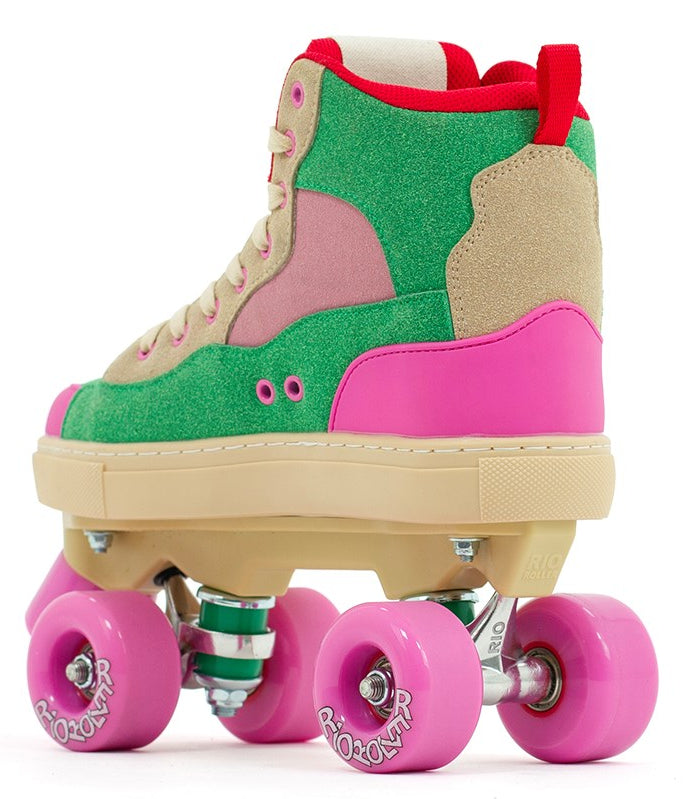 The Rio Roller Beats Quad Roller Skates by Rio Roller feature a vegan boot in green, pink, and beige with a beige sole, red trim, and pink wheels, shown on a white background.