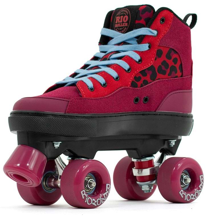 The Rio Roller Beats Quad Roller Skates in Red/Leopard feature a vibrant red and black vegan-friendly design with light blue laces, leopard print accents, pink wheels, and the Rio Roller logo on the tongue and wheels.