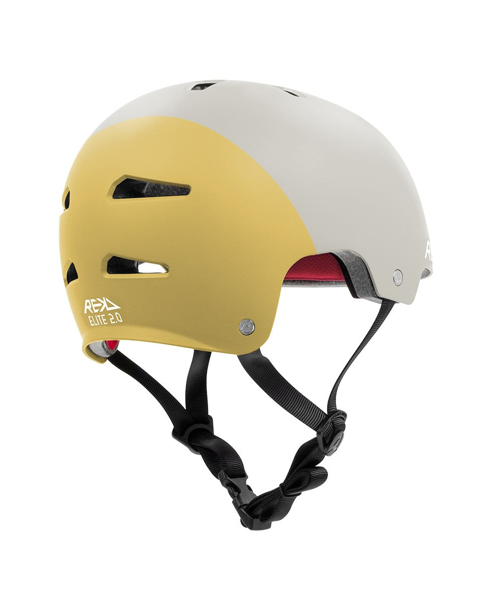 The REKD Elite 2.0 Skate/Scooter Helmet in Grey/Yellow features a two-tone design with ventilation slots, black adjustable straps, a red inner lining, and "REKD ELITE 2.0" branding on the side.