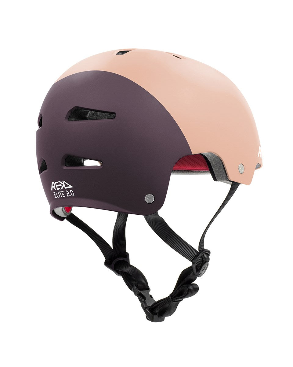 The REKD Elite 2.0 Skate / Scooter Helmet in peach and purple features ventilation slots, adjustable black straps, and REKD branding—offering comfort and protection for action sports.