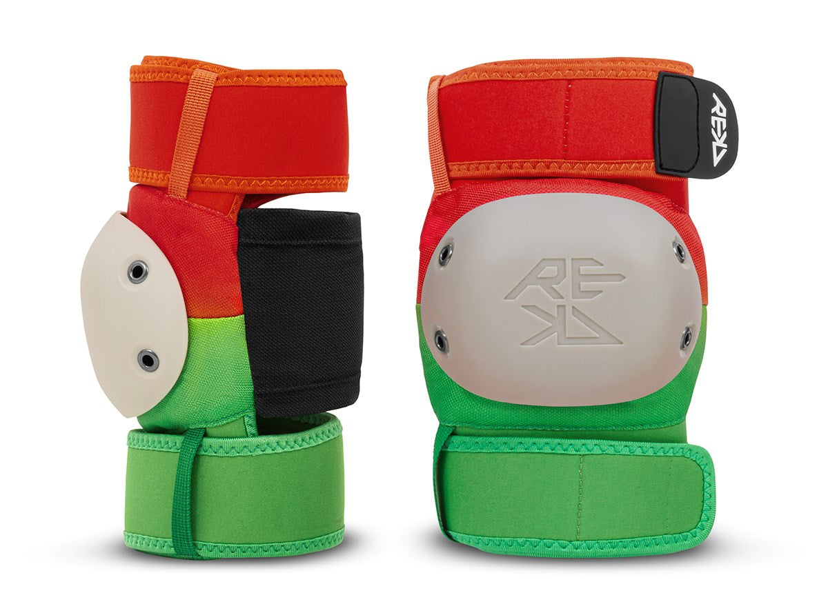 The REKD Shield Triple Skate Protection Pad Set in Fade Orange / Green, by REKD, showcases two vibrant wrist guards with bold red, orange, green, and black sections accented by white protective plates. The wrist guards are displayed side by side against a white background.
